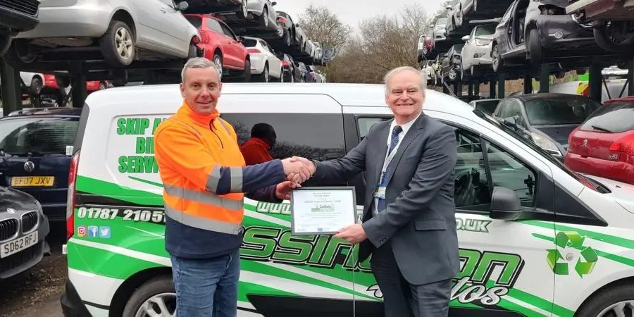 Frederick Cook, CEO of Assington Autos Ltd, receives the Carbon Charter award.