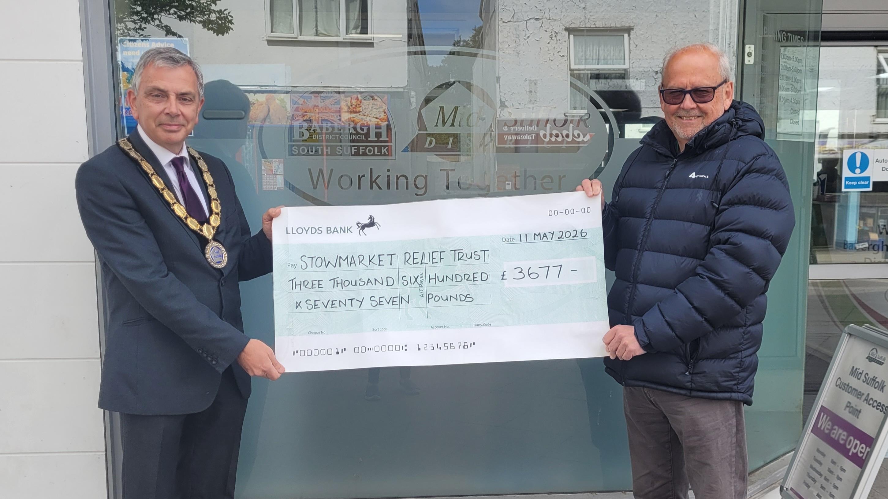 Cllr Keith Scarff presenting cheque to David Palk from Stowmarket Relief Trust