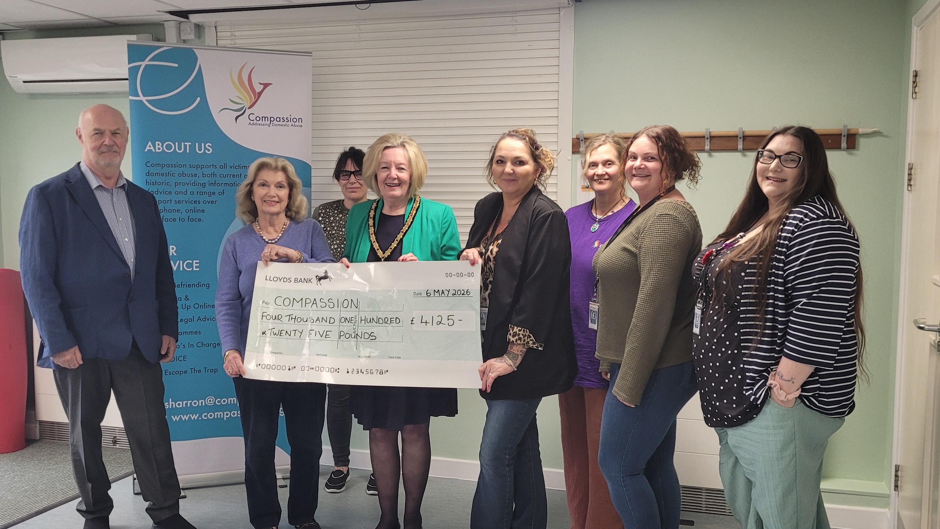 Cllr Malvisi presenting the cheque to representatives from Compassion (from left to right): Tony, Kirsten, Beth, Cllr Malvisi, Natalee, Nicola, Chelsea, Shana